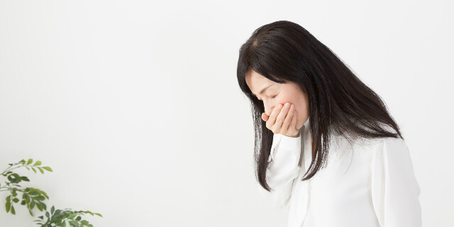 吐き気がする女性