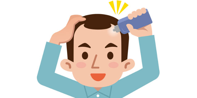 育毛剤を塗る男性